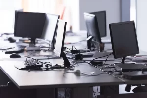 Bank of desk with computers on